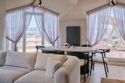 a living room with a couch and a table at BSY Flats Well Decorated Modern Apartments With 2BR, 3BR Options in Istanbul