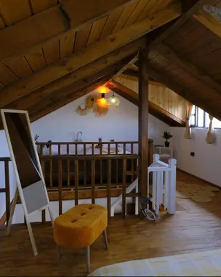 a room with a chair and a wooden ceiling at Sapanca Balkaya Bungalov in Sapanca