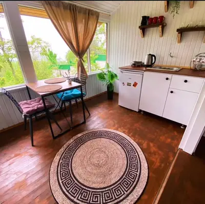 a kitchen with a table and a table and a tableablish at Sapanca Balkaya Bungalov Dağ evi in Sapanca