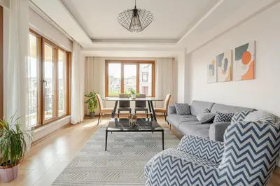 a living room with a couch and a table at New Stylish Apartment with Panoramic Views in Istanbul