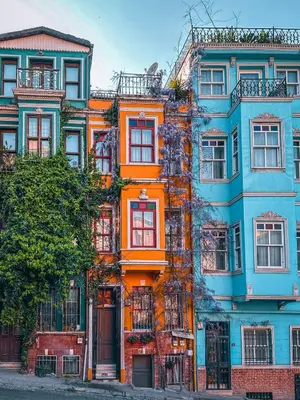 an orange building with many windows on a street at New Stylish Apartment with Panoramic Views in Istanbul