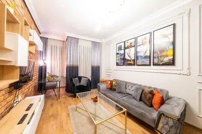 a living room with a couch and a table at King Suit Beşiktaş apart in Istanbul