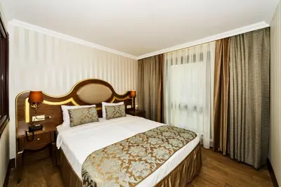 a hotel room with a bed and a window at The Central Hotel in Istanbul