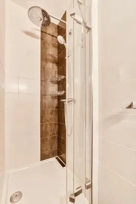 a shower with a glass door in a bathroom at İSTANBUL Taksim Palece OTEL in Istanbul