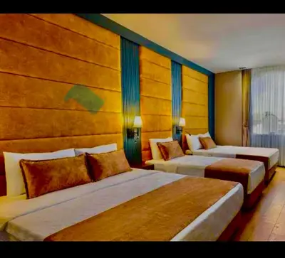 a hotel room with three beds in a room at İSTANBUL Taksim Palece OTEL in Istanbul