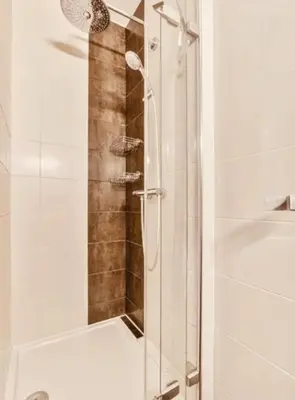 a shower with a glass door in a bathroom at İSTANBUL Taksim Palece OTEL in Istanbul