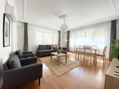 a living room with a couch and a table at Excelent Location & Spacious No3 in Istanbul