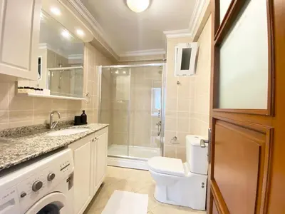 a bathroom with a shower and a toilet and a sink at Excelent Location & Spacious No3 in Istanbul