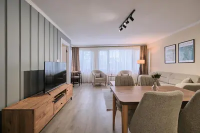 a living room with a flat screen tv and a couch at House Kadıköy in Istanbul