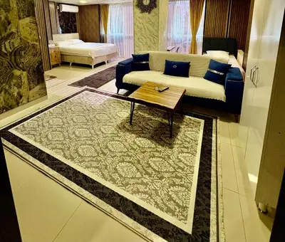 a living room with a couch and a table at Nera Otel in Istanbul
