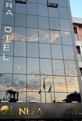 a reflection of the sky in the side of a building at Nera Otel in Istanbul