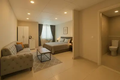 a hotel room with a bed and a couch at Nera Otel in Istanbul