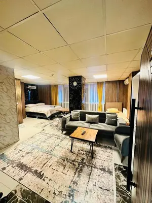 a living room with a couch and a table at Nera Otel in Istanbul