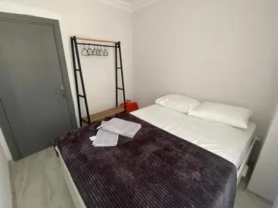 a small bedroom with a bed with a towel on it at ŞAH apartmanı in Istanbul