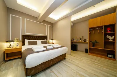a bedroom with a large bed with two pillows at The Deal of taksim apartment in Istanbul