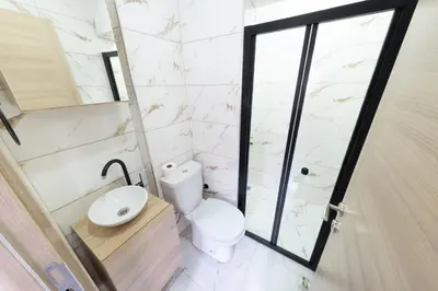 a bathroom with a toilet and a sink and a shower at Lomend Hotels in Istanbul