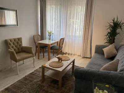 a living room with a couch and a table at Şah in Istanbul