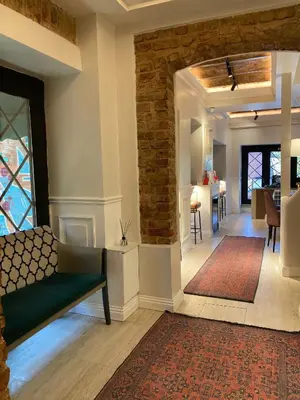 a living room with a couch and a rug at Vion Hotel Taksim in Istanbul