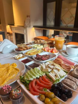 a table with many different types of food on it at Vion Hotel Taksim in Istanbul