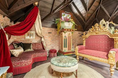 a living room with two red couches and a table at NOLD Suite in Istanbul