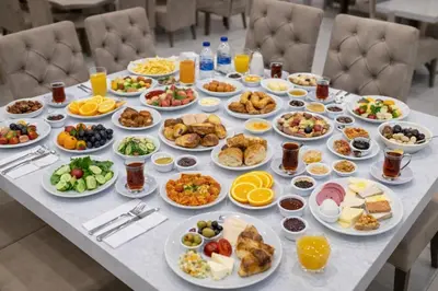 a table full of breakfast foods and drinks at Akgün Hotel Laleli Istanbul in Istanbul