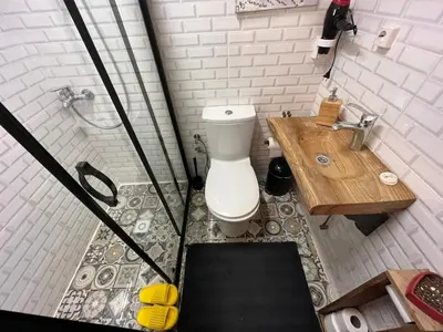 a bathroom with a toilet and a sink and a shower at Sapanca Turuncu Hobbit Evi in Sapanca
