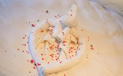 a cake with white frosting and red sprinkles at Hill House Hostel in Istanbul