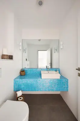 a bathroom with a blue tiled tub and a toilet at Stunning Sea View, Peaceful Family Villa with AC, Sauna, Gym & Shared Pool in Silivri