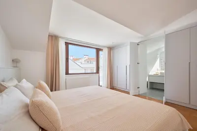a white bedroom with a large bed and a window at Stunning Sea View, Peaceful Family Villa with AC, Sauna, Gym & Shared Pool in Silivri