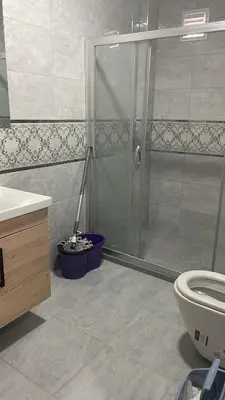a bathroom with a shower and a toilet at Apart house in Istanbul