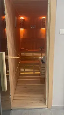 a walk in closet with wood paneling at Apart house in Istanbul