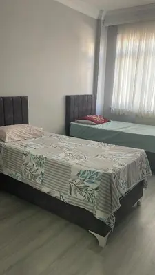 a bedroom with two beds in a room at Apart house in Istanbul