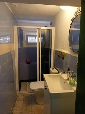a bathroom with a toilet and a sink and a shower at Art & Natura in Marmara