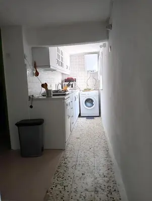 a kitchen with a washer and dryer in a room at Art & Natura in Marmara