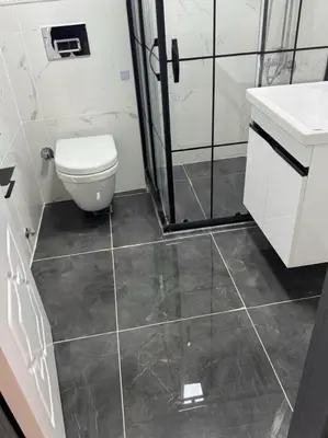 a bathroom with a toilet and a shower at Innova Suit Hotel in Istanbul