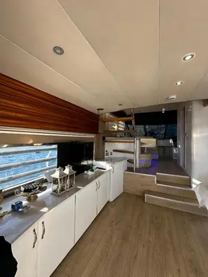 a kitchen with white cabinets and a staircase in a boat at Rotavira YAT KİRALAMA PLATFORMU in Istanbul