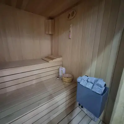 a sauna with a bench and a wooden floor at Luxury Family Villa with Private Pool & Slide in Gemlik