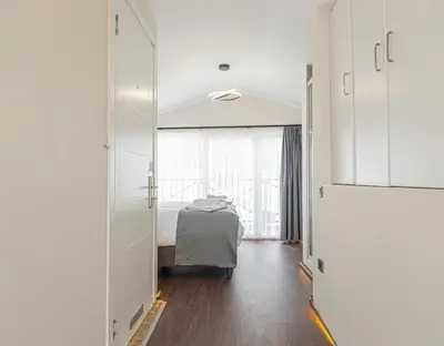 a bedroom with a bed and a large mirror at Galata heart suits in Istanbul