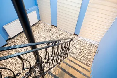 a balcony with a metal railing and a staircase at Galata heart suits in Istanbul