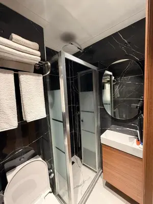 a bathroom with a shower and a toilet and a sink at City Istiklal in Istanbul