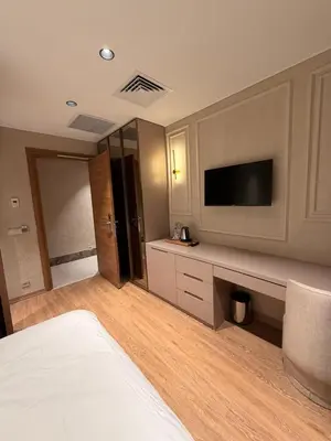 a hotel room with a bed and a tv and a room at City Istiklal in Istanbul
