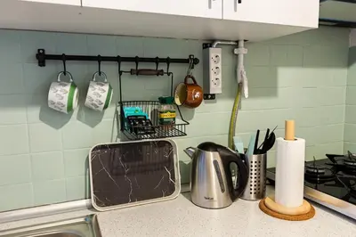 a kitchen counter with a sink and a stove at 2BR Historical apartment 5 min to Taksim Sq in Istanbul