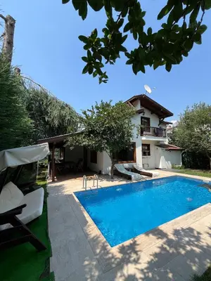 a villa with a swimming pool and a house at Selbeshome in Sapanca