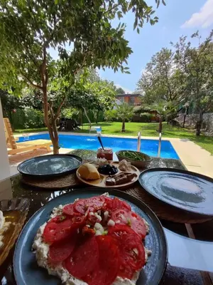 a table with plates of food on top of it at Selbeshome in Sapanca