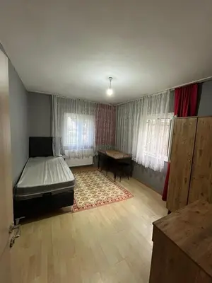 a bedroom with a bed and a desk in it at Taksim metro central Suites hotel in Istanbul