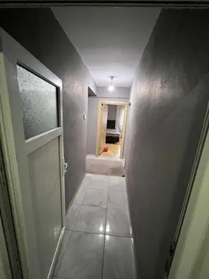 a hallway with a white door and a room at Taksim metro central Suites hotel in Istanbul