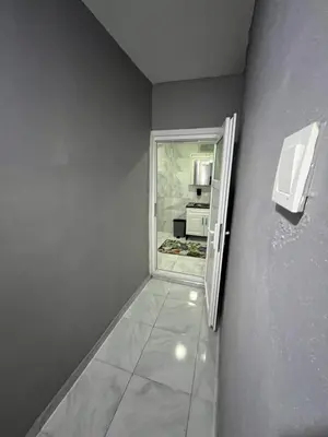 a small room with a refrigerator and a kitchen at Taksim metro central Suites hotel in Istanbul