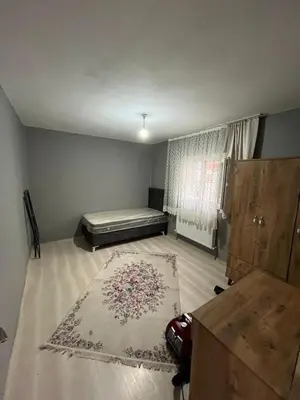 a bedroom with a bed and a rug on the floor at Taksim metro central Suites hotel in Istanbul