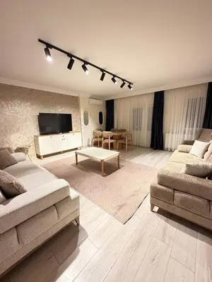 a living room with two couches and a flat screen tv at Luxury Apartment In A Great Location 10 in Istanbul