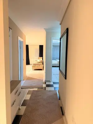 a hallway with a living room with a couch at Luxury Apartment In A Great Location 10 in Istanbul